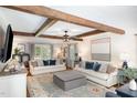 Cozy living room with beamed ceilings, shiplap wall detail, and plush seating at 509 Queensferry Rd, Cary, NC 27511