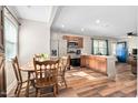 Bright open kitchen featuring wood cabinets, stainless steel appliances and eat in dining area at 513 S Cheatham St, Franklinton, NC 27525