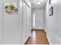 Bright foyer with wood floors and a front door with sidelights at 627 Nixon Dr, Sanford, NC 27330