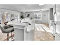 Bright, open kitchen featuring granite countertops and seating at the breakfast bar at 627 Nixon Dr, Sanford, NC 27330