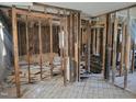 Interior view showing exposed framing, flooring, and wall studs at 707 Dickens St, Roxboro, NC 27573