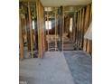 An interior renovation in progress; exposed wall studs and flooring at 707 Dickens St, Roxboro, NC 27573