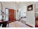 Inviting foyer with hardwood floors, arched doorway, and a view into the well-lit living area at 7687 Mattie Rd, Rocky Mount, NC 27803