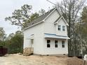 New home featuring white siding, an inviting porch, and ample natural light at 908 Colfax St, Durham, NC 27701