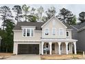 Charming two-story home with a welcoming front porch and attached two-car garage in a desirable neighborhood at 9152 Dupree Meadow Dr # 12, Angier, NC 27501