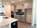 Beautiful kitchen features stainless steel appliances, gas cooktop, ample storage, and a large island at 9152 Dupree Meadow Dr # 12, Angier, NC 27501
