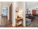 Inviting living room featuring dark-toned hardwood floors and neutral walls, creating a cozy yet stylish atmosphere at 104 Amberhill Ct, Garner, NC 27529