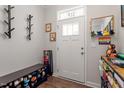 Entryway features a coat rack, shoe storage, and modern decor accents at 117 Highland Forest Dr, Fuquay Varina, NC 27526