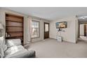 Cozy living room featuring carpet floors and a large window at 1507 Ridgeway Ave, Durham, NC 27701