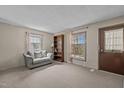 Comfortable living room with neutral carpet, sofa and bookshelf at 1507 Ridgeway Ave, Durham, NC 27701