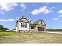 Beautiful home featuring stone and vinyl siding, complemented by well-maintained landscaping and a lush lawn at 151 S Harper Faith Way, Benson, NC 27504
