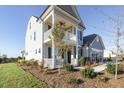 The property has a manicured lawn and inviting outdoor space, perfect for relaxing at 1515 Willbrook Dr, Fuquay Varina, NC 27526