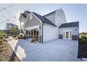 Home with rear patio space, manicured landscaping, and an entertainment space at 1515 Willbrook Dr, Fuquay Varina, NC 27526