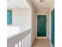 Condo doorway with a green painted door, with white trim and railings at 2621 Wellington Ridge Loop, Cary, NC 27518