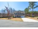 Charming two-story home features a stone accent, large front porch, and a well-maintained yard at 40 Poplar Bark Dr, Youngsville, NC 27596