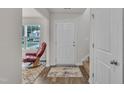 Bright foyer featuring a neutral color palette, wood flooring, and a staircase at 40 Poplar Bark Dr, Youngsville, NC 27596