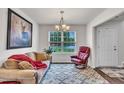 Cozy living room with ample natural light from the window and comfortable seating at 40 Poplar Bark Dr, Youngsville, NC 27596
