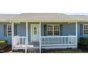 Close-up of the front porch with white railings and a decorative front door at 41 Rock Bluff Ln, Kittrell, NC 27544