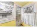 Cozy sunroom with natural light offering peaceful views at 413 S Maple St, Graham, NC 27253