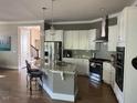 Spacious kitchen with stainless steel appliances, granite countertops, and a large island at 465 Claremont Dr, Chapel Hill, NC 27516
