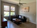 Comfortable seating area with a ceiling fan and lots of natural light at 465 Claremont Dr, Chapel Hill, NC 27516
