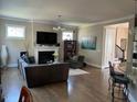 Cozy living room with fireplace, hardwood floors, and natural light at 465 Claremont Dr, Chapel Hill, NC 27516