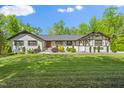 Ranch-style home with well-manicured lawn and landscaping, enhancing its curb appeal at 5313 Edington Ln, Raleigh, NC 27604