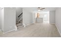 Bright living room with laminate flooring and staircase with great access to the kitchen at 5340 Big Bass Dr, Raleigh, NC 27610