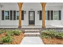 Front door with brick stairs and wooden support beams at 5450 Hunter Hill Rd, Rocky Mount, NC 27804