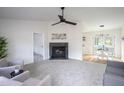 Bright living room featuring a cozy fireplace and neutral color palette at 602 N Mineral Springs Rd, Durham, NC 27703