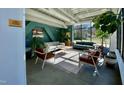 Inviting lobby lounge with comfortable seating, natural light, plants, and contemporary decor at 610 Trent Dr # 202, Durham, NC 27705