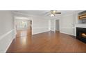 Spacious living room featuring hardwood floors and a cozy fireplace at 63 Halter Ct, Angier, NC 27501