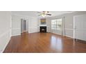 Open living room with lots of natural light, fireplace, and open floor plan at 63 Halter Ct, Angier, NC 27501