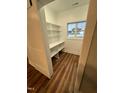 Pantry includes lots of shelving and a natural light source at Lot 14H Good Shepherd Trl, Spring Hope, NC 27882
