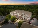 Expansive aerial perspective of a multi-Gathering home featuring a well-maintained exterior and surrounding greenery at 10400 Rosegate Ct # 3, Raleigh, NC 27617