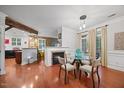 Bright dining area with glass table, fireplace and natural light at 10400 Rosegate Ct # 3, Raleigh, NC 27617