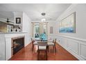Inviting dining room with fireplace, glass table and four chairs at 10400 Rosegate Ct # 3, Raleigh, NC 27617
