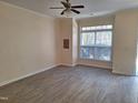 Sunlit living room with big windows and durable floors at 11711 Mezzanine Dr # 109, Raleigh, NC 27614