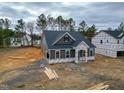 Stylish single-story home with gray siding and clean lines, set in a developing neighborhood at 195 Duncan Creek Rd # 123, Lillington, NC 27546