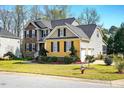 Well maintained house with manicured lawn, with view of the side facing two car garage at 2006 Prairie Ridge Ct, Fuquay Varina, NC 27526