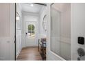 Bright entryway with wood floors, a front door with glass, and stylish wainscoting at 217 Duncan Creek Rd # 124, Lillington, NC 27546