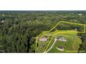 Expansive aerial view of a home and its surrounding property, showcasing the spacious lot at 2751 Old Fairground Rd, Angier, NC 27501