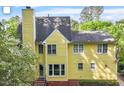 Yellow siding with white trim on this backyard view of the home at 2812 Dahlgreen Rd, Raleigh, NC 27615