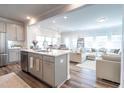 Bright, open-concept living spaces featuring a modern kitchen, dining area, and cozy living room at 3144 Star Gazing Ln, Durham, NC 27703