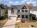 Aerial view of a two-story home with well-manicured landscaping in a residential neighborhood at 3557 S Beaver Ln, Raleigh, NC 27604