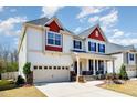 Lovely two-story home featuring a spacious two-car garage and welcoming front porch at 3557 S Beaver Ln, Raleigh, NC 27604