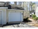 A large single car garage sits adjacent to the home with dedicated driveway parking at 362 Linden Close, Pittsboro, NC 27312