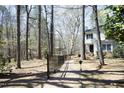 The home has brick walkway and lush natural landscaping at 362 Linden Close, Pittsboro, NC 27312