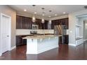 Spacious kitchen island with granite countertops and stainless steel appliances at 4026 Overcup Oak Ln, Cary, NC 27519