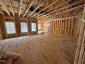 Unfinished living room showcases the stud-framing and subflooring prior to completion at 452 Duncan Creek Rd # 156, Lillington, NC 27546